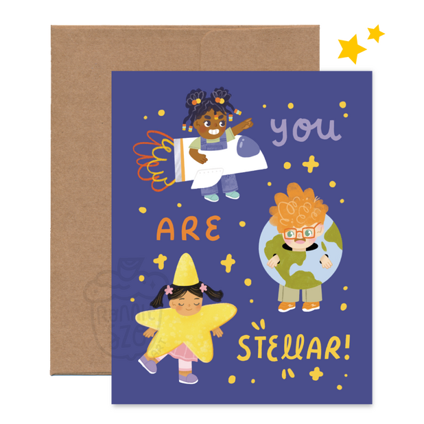 A greeting card design, featuring three kids wearing different space related costumes. One is wearing a space ship, another is wearing an earth, and the third is wearing a star. The words surrounding the kids say "You are Stellar"